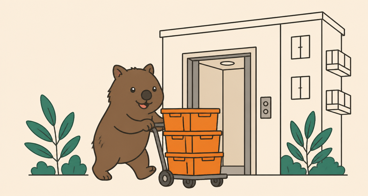 Wal the wombat wheeling orange moving crates out of an apartment lift